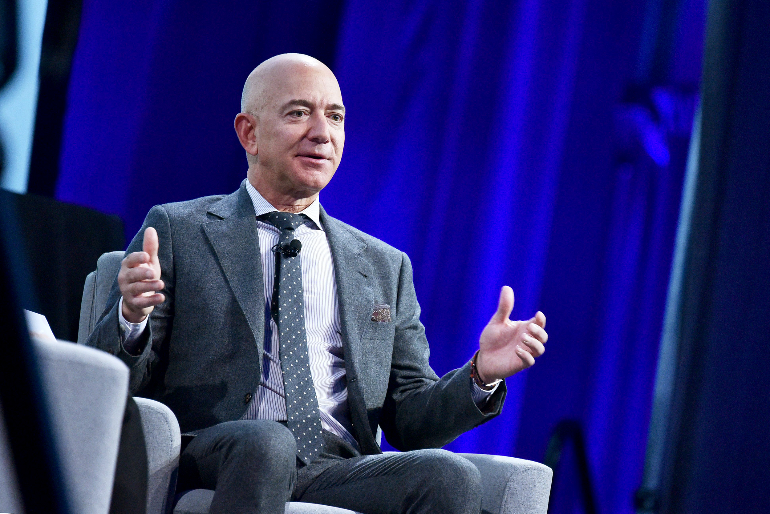 Blue Origin founder Jeff Bezos speaks after receiving the 2019 International Astronautical Federation (IAF) Excellence in Industry Award during the the 70th International Astronautical Congress at the Walter E. Washington Convention Center in Washington, DC on October 22, 2019. (Photo by MANDEL NGAN / AFP) (Photo by MANDEL NGAN/AFP via Getty Images)