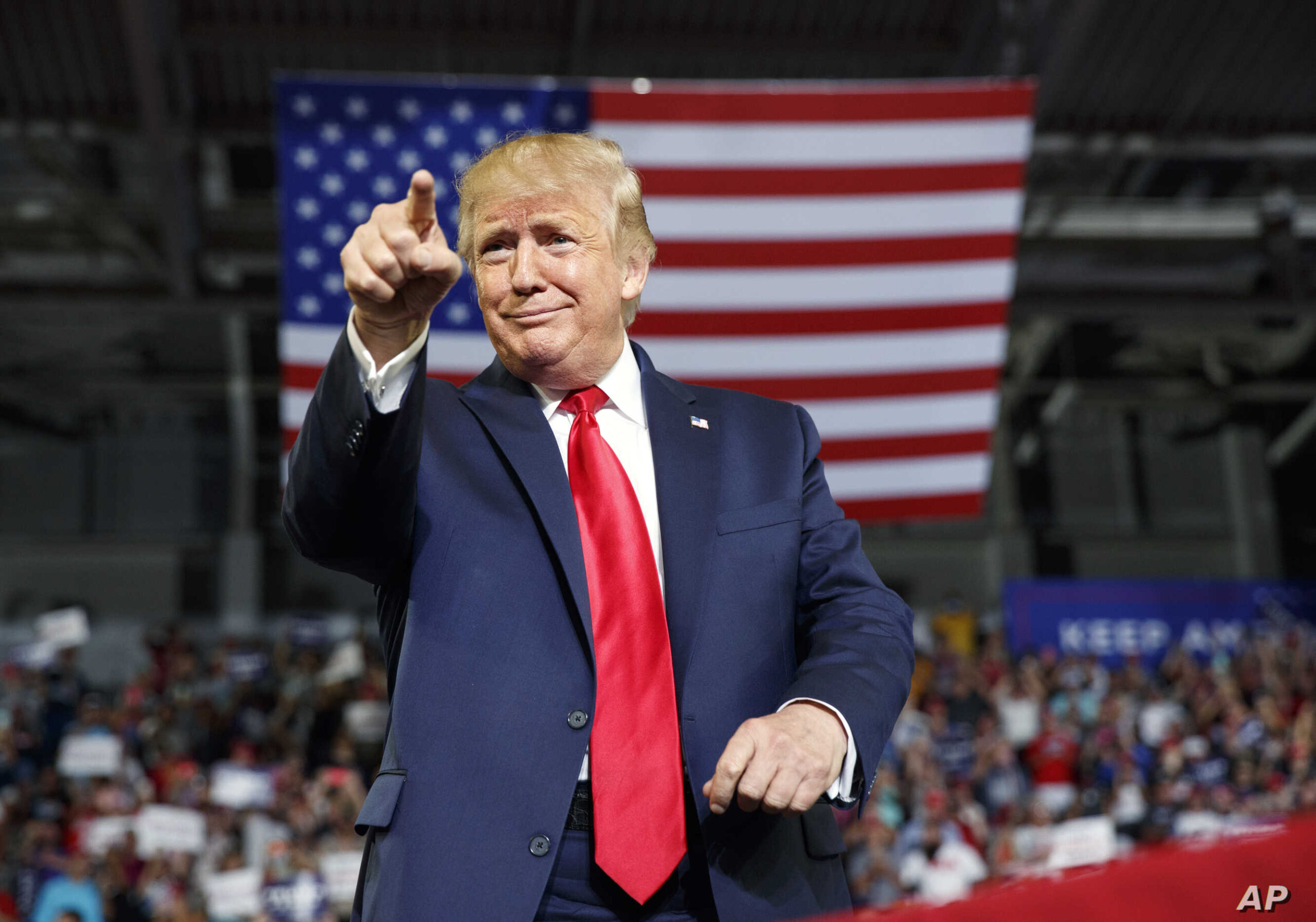 President Donald Trump gestures to the crowd as he arrives to speak at a campaign rally at Williams Arena in Greenville, N.C., Wednesday, July 17, 2019. (AP Photo/Carolyn Kaster)