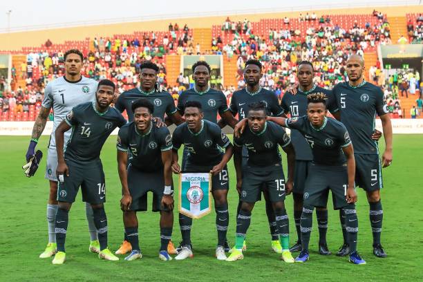 (Top L-R) Nigeria's goalkeeper Maduka Okoye, forward Taiwo Awoniyi, defender Kenneth Omeruo, midfielder Wilfred Ndidi, midfielder Joe Aribo, defender William Troost-Ekong, (bottom L-R) forward Kelechi Iheanacho, defender Ola Aina, defender Zaidu Sanusi, forward Moses Simon and  forward Samuel Chukwueze pose prior to the  Group D Africa Cup of Nations (CAN) 2021 football match between Nigeria and Egypt at Stade Roumde Adjia in Garoua on January 11, 2022. (Photo by Daniel BELOUMOU OLOMO / AFP) (Photo by DANIEL BELOUMOU OLOMO/AFP via Getty Images)