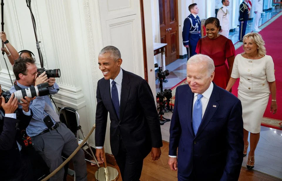 U.S. President Joe Biden and Jill Biden host former U.S. President Barack Obama and Michelle Obama for the unveiling of their official White House portraits in the East Room of the White House, in Washington, U.S., September, 7, 2022. REUTERS/Evelyn Hockstein/File Photo