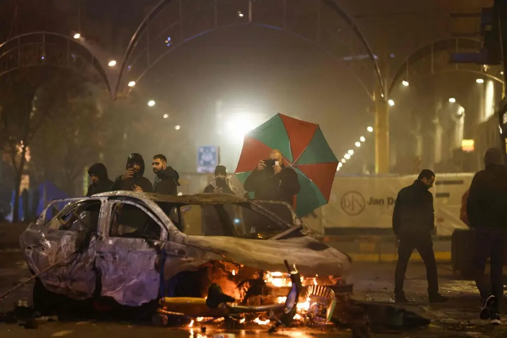 Aftermath of Belgium's 2-0 loss to Morocco saw a car set ablaze in Brussels/Getty Images