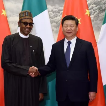 Presidents Muhammadu Buhari of Nigeria and Xi Jinping of China exchange pleasantries during an event/Getty