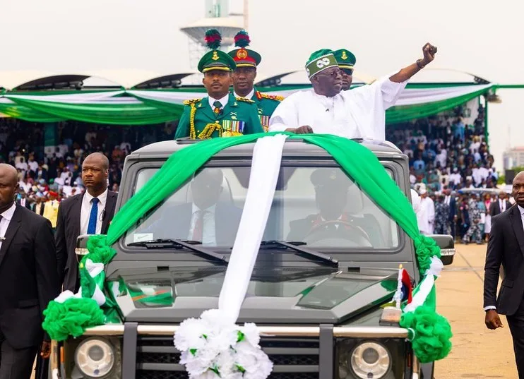 President Tinubu waves to the people during his inauguration/Instagram @officialasiwajubat