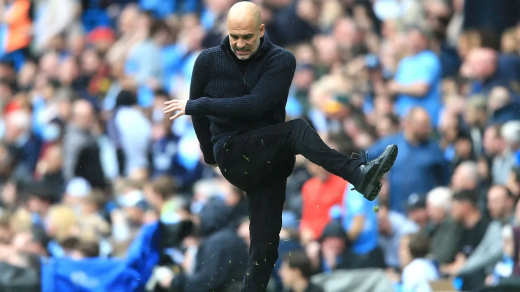 Pep Guardiola reacts angrily during a match/Getty Images