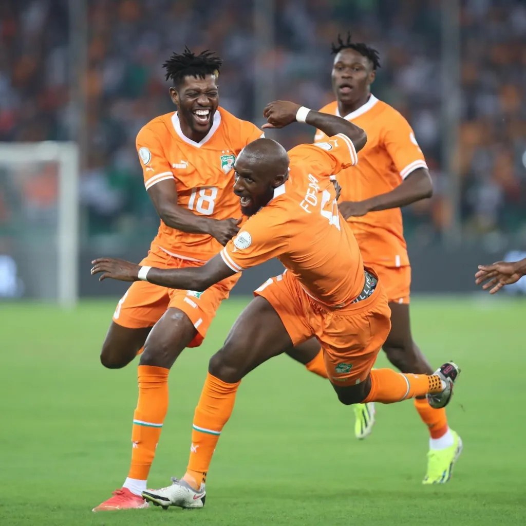 Seko Fofana celebrates with teammates after scoring the first goal of the 2023 AFCON/CAF