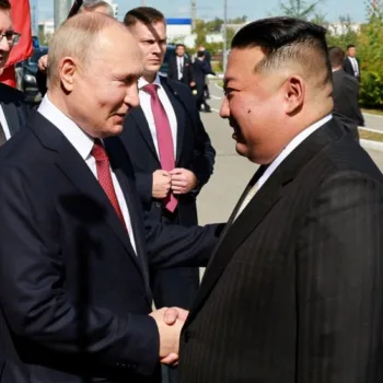Putin and Kim exchange pleasantries/Reuters