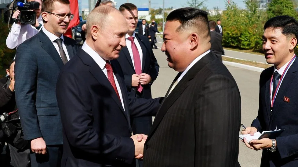 Putin and Kim exchange pleasantries/Reuters