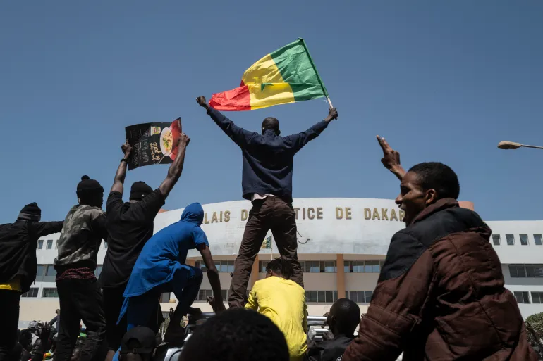 Citizens took to the streets to protest President Sall's decision to postpone the presidential election/AP