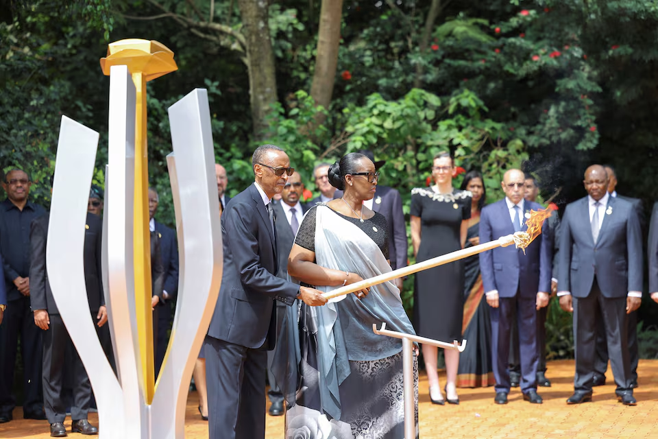 President Kagame and First Lady Jeannette prepares to light the the "Kwibuka," the Rwandan genocide flame of hope/Reuters