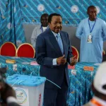 President Paul Biya after casting his vote/Reuters
