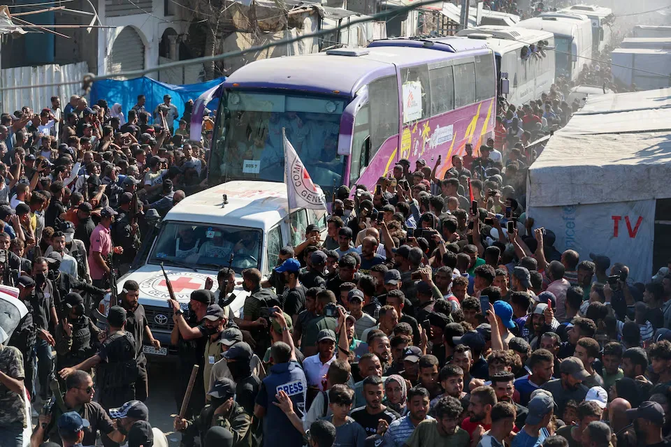 At Nasser hospital in Khan Younis, southern Gaza Strip, crowds assemble to greet Palestinian detainees freed by Israel on October 13, 2025, under a prisoner exchange and ceasefire agreement between Israel and Hamas. REUTERS/Ramadan Abed