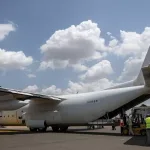 Here's a rephrased version: On Monday, June 9, 2025, workers prepare a Fogbow aid aircraft at Juba airport in South Sudan for food airdrop missions over the Upper Nile region/AP