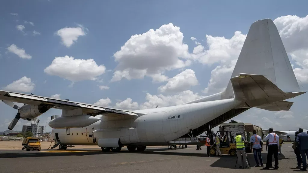 Here's a rephrased version: On Monday, June 9, 2025, workers prepare a Fogbow aid aircraft at Juba airport in South Sudan for food airdrop missions over the Upper Nile region/AP