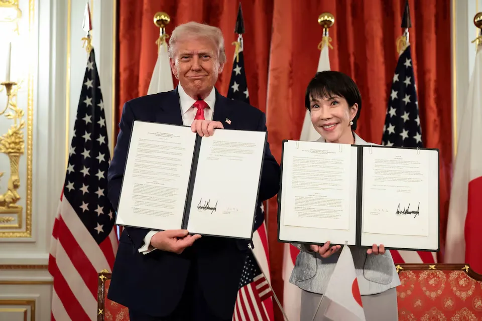 Donald Trump and Japanese Prime Minister Sanae Takaichi display documents they have signed concerning the security of critical mineral and rare earth supplies. REUTERS/Evelyn Hockstein