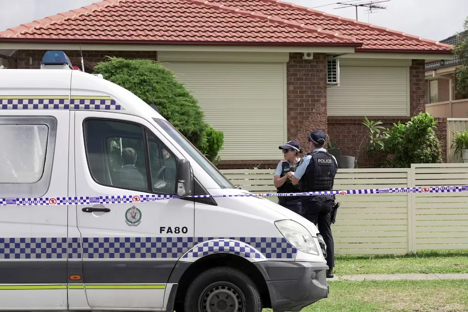 Police officers maintain security at the residence of individuals suspected in a shooting attack during a Jewish holiday gathering at Bondi Beach, located in Bonnyrigg, Sydney, Australia, on December 15, 2025/ REUTERS/Alasdair Pal