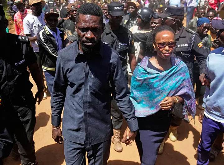 Bobi Wine and his wife arrive at a Kampala polling station to cast their votes in Uganda's presidential election on 15 January 2026. 30 people have been killed post-election/AP