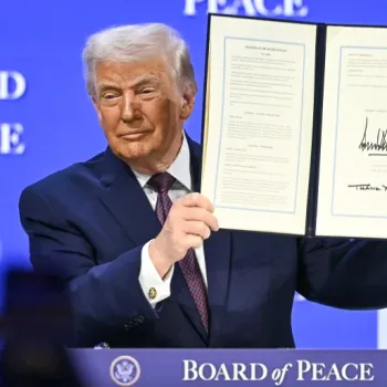 Donald Trump, the US President, displays a signed founding charter for the Board of Peace at the World Economic Forum in Davos, Switzerland, on January 22, 2026 [AFP]