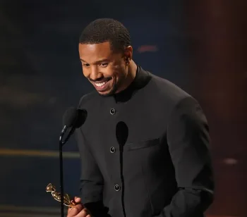 Michael B. Jordan receives his Best Actor Award at the Oscars 2026/Getty