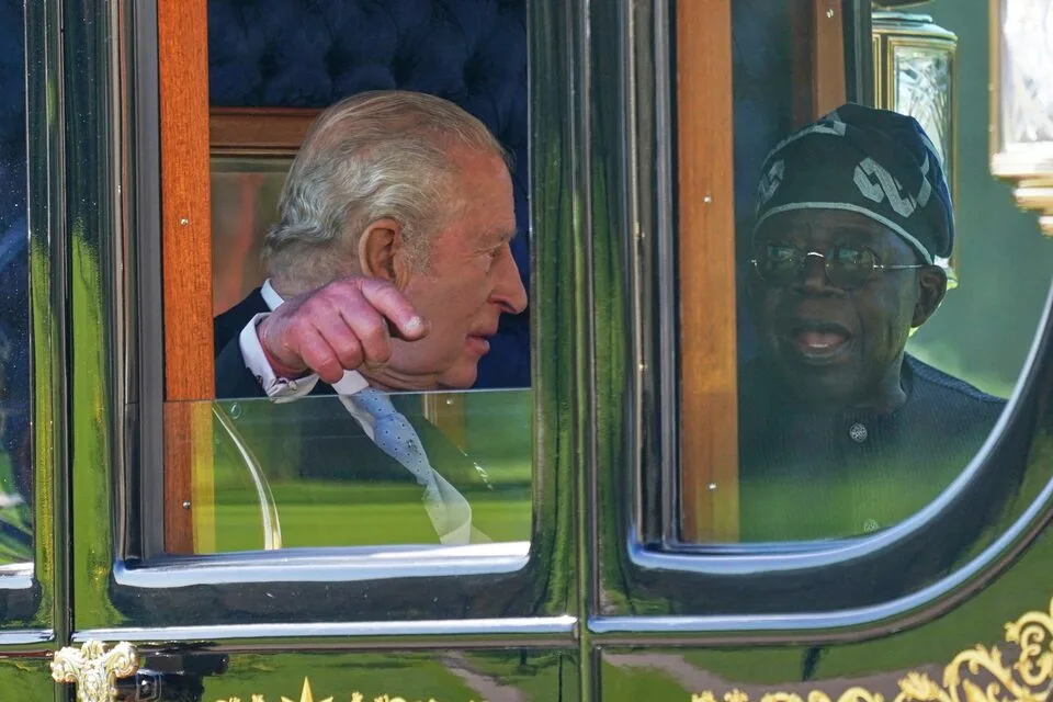 President Bola Ahmed Tinubu and Britain's King Charles III share a moment aboard a carriage en route to Windsor Castle, as part of the ceremonial welcome marking the President's state visit to the United Kingdom in Windsor, Wednesday, March 18, 2026. (Photo: Alberto Pezzali/Pool via REUTERS)
