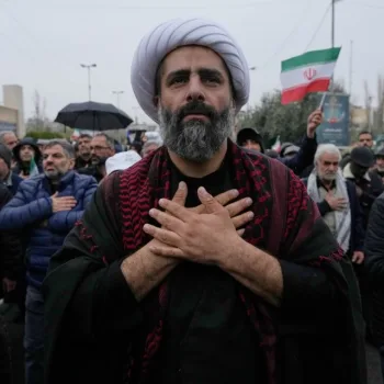 Iranians line up the stress in demonstration as the fighting continues/AP