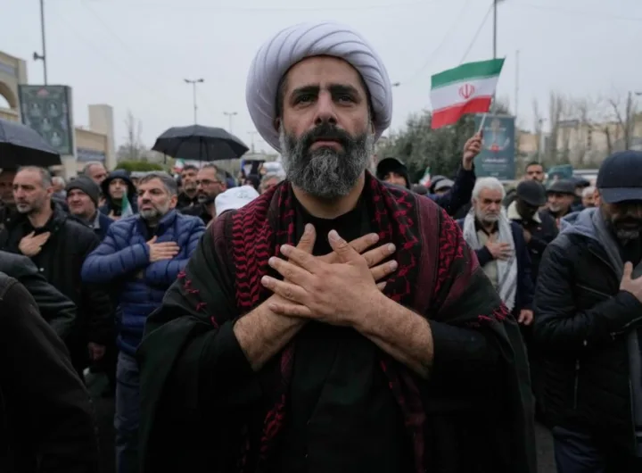 Iranians line up the stress in demonstration as the fighting continues/AP