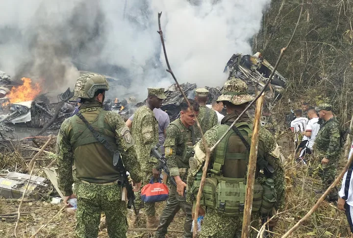 Military personnel assemble at the scene where a Colombian military plane went down in Puerto Leguizamo, Putumayo, Colombia, on March 23, 2026. — La Voz de Amazonia/Mare Rafue/Handout via REUTERS