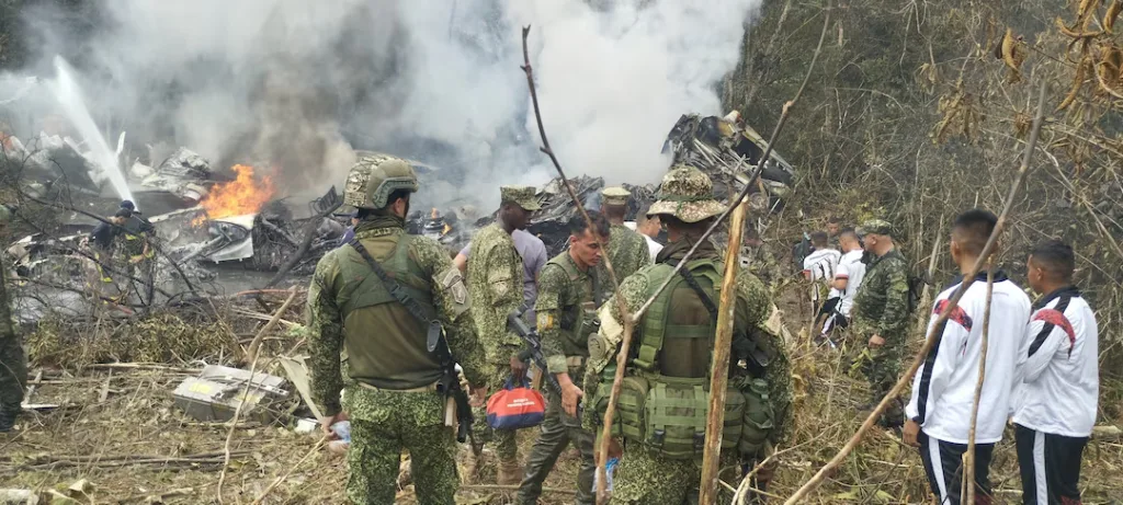 Military personnel assemble at the scene where a Colombian military aircraft went down in Puerto Leguizamo, Putumayo, Colombia, on March 23, 2026. — La Voz de Amazonia/Mare Rafue/Handout via REUTERS