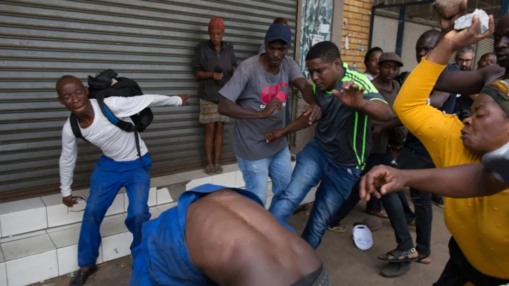 Xenophobic mob attacks a Nigerian in South Africa/Photo: Reuters