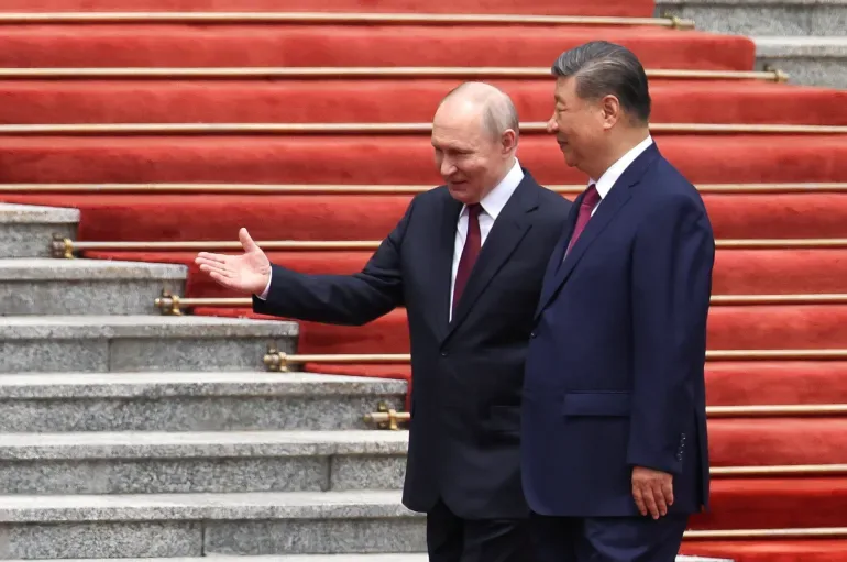 Russian President Vladimir Putin and China's President Xi Jinping are pictured together during a welcoming ceremony held at the Great Hall of the People in Beijing on Wednesday. [Maxim Shemetov/Pool/Reuters]