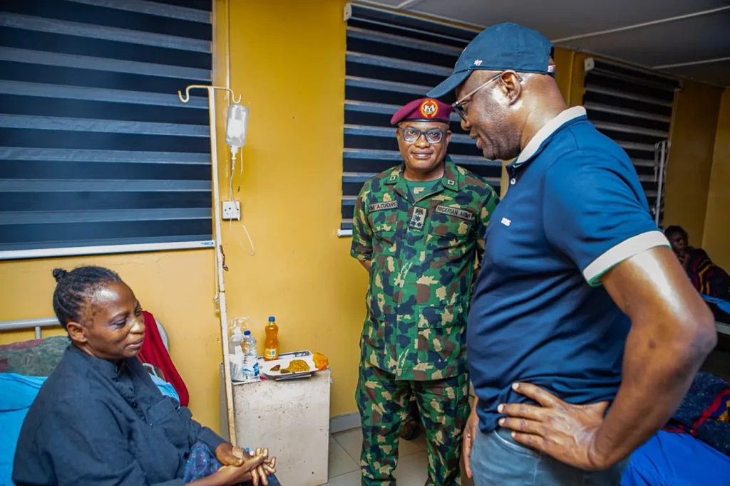 Governor Seyi Makinde (right) is pictured visiting a teacher who was kidnapped by terrorists in May, following her release from captivity. The visit took place at a hospital in Oyo State on July 11, 2026. The image was released by the Oyo State government house