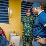 Governor Seyi Makinde (right) is pictured visiting a teacher who was kidnapped by terrorists in May, following her release from captivity. The visit took place at a hospital in Oyo State on July 11, 2026. The image was released by the Oyo State government house