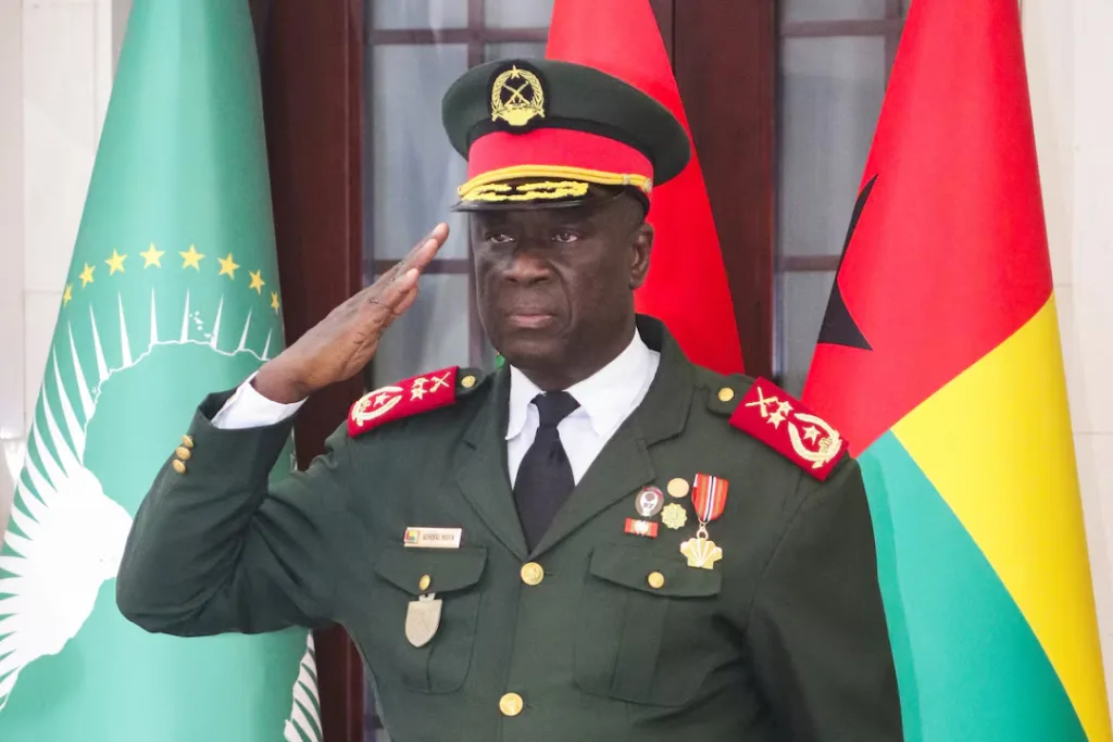 Major-General Horta Inta-a, Guinea-Bissau's new transitional president, offers a salute during the ceremony marking Major-General Tomas Djassi's swearing-in as the new Armed Forces chief of staff, held in Bissau on November 27, 2025. Photo: REUTERS/Delcyo Sanca