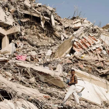 Man searches through the rubble from the earthquake in Venezuela