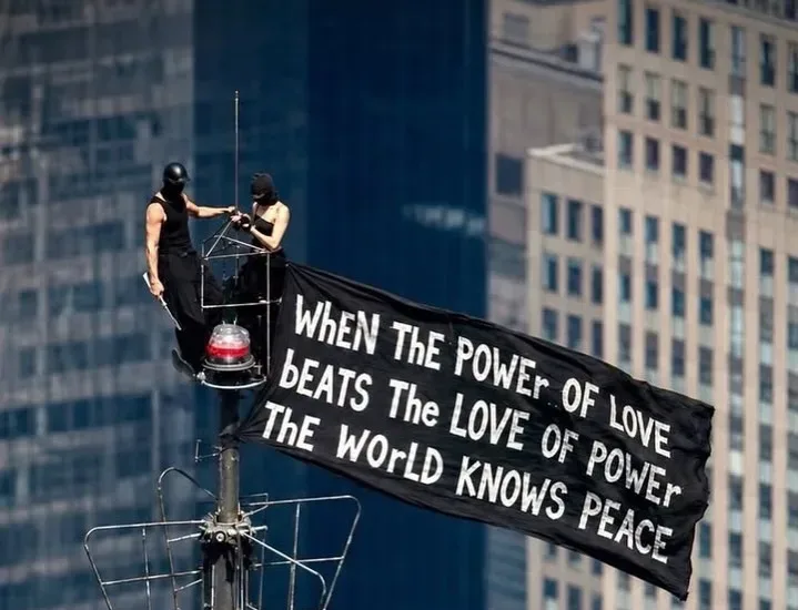The couple delivered a peace message atop the Empire State Building/Instagram @angela_nikolau