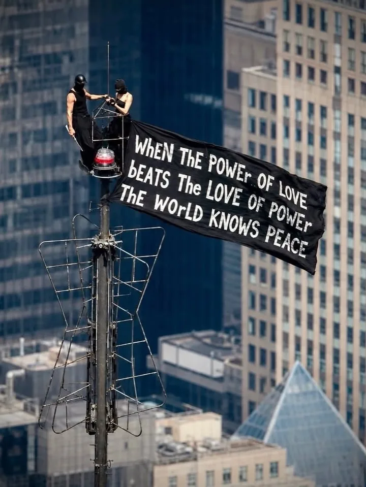 Angela Nikolau and Ivan Kuznetsov unfurled a peace banner atop the Empire State Building/ 