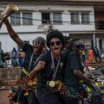 Cameroonian players celebrate during the trophy parade/Photo: Getty