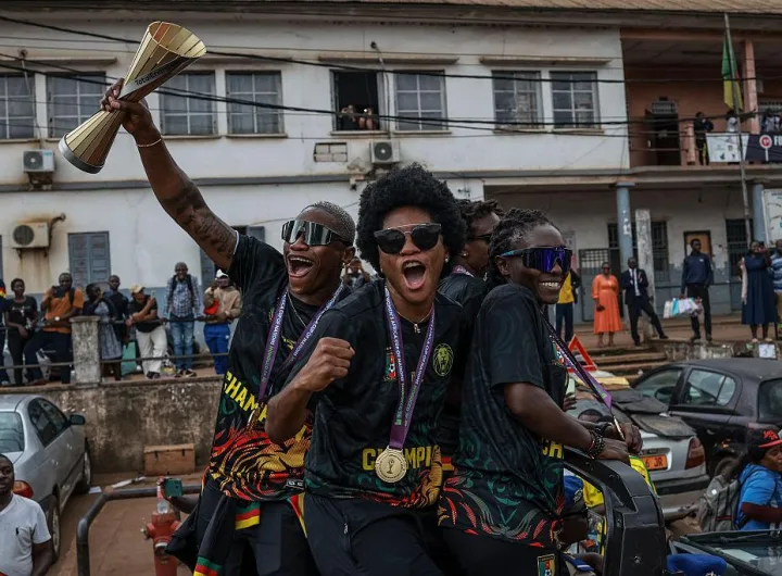 Cameroonian players celebrate during the trophy parade/Photo: Getty