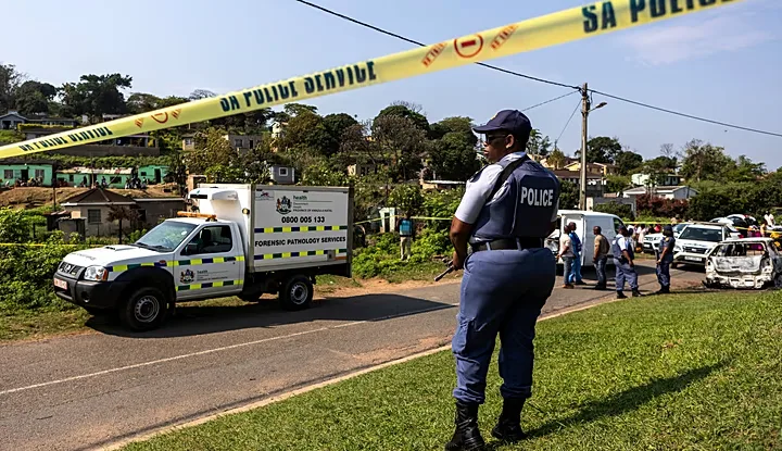 A police officer stands at the scene of a mass shooting at a house party in KwaMakhutha, a township south of Durban, South Africa, on Wednesday, Sept. 23, 2026. /Photo: AP