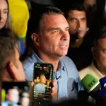 Flavio Bolsonaro is headed to a runoff after the first round of Brazil's presidential election. Eraldo Peres/AP