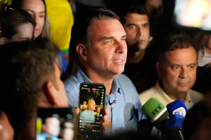 Flavio Bolsonaro is headed to a runoff after the first round of Brazil's presidential election. Eraldo Peres/AP